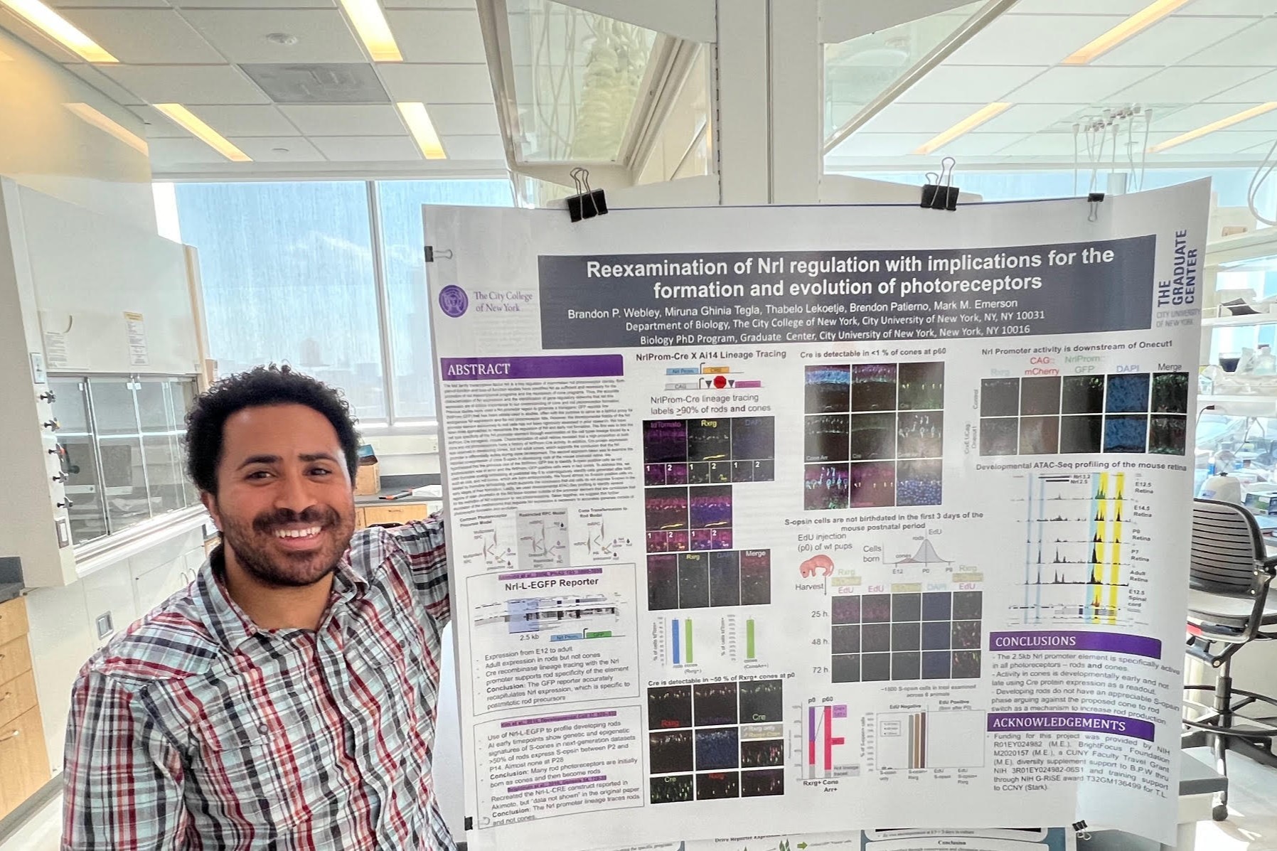 Brandon poses next to GRC 2024 poster